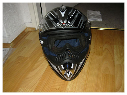 Face on helmet with goggles